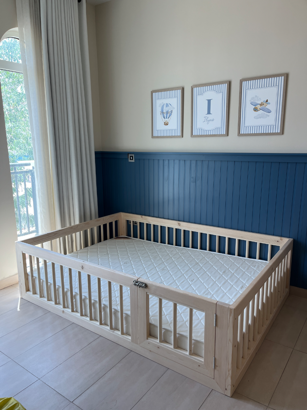 Capri Montessori floor bed handmade in Dubai, solid Canadian pinewood, in a child's nursery