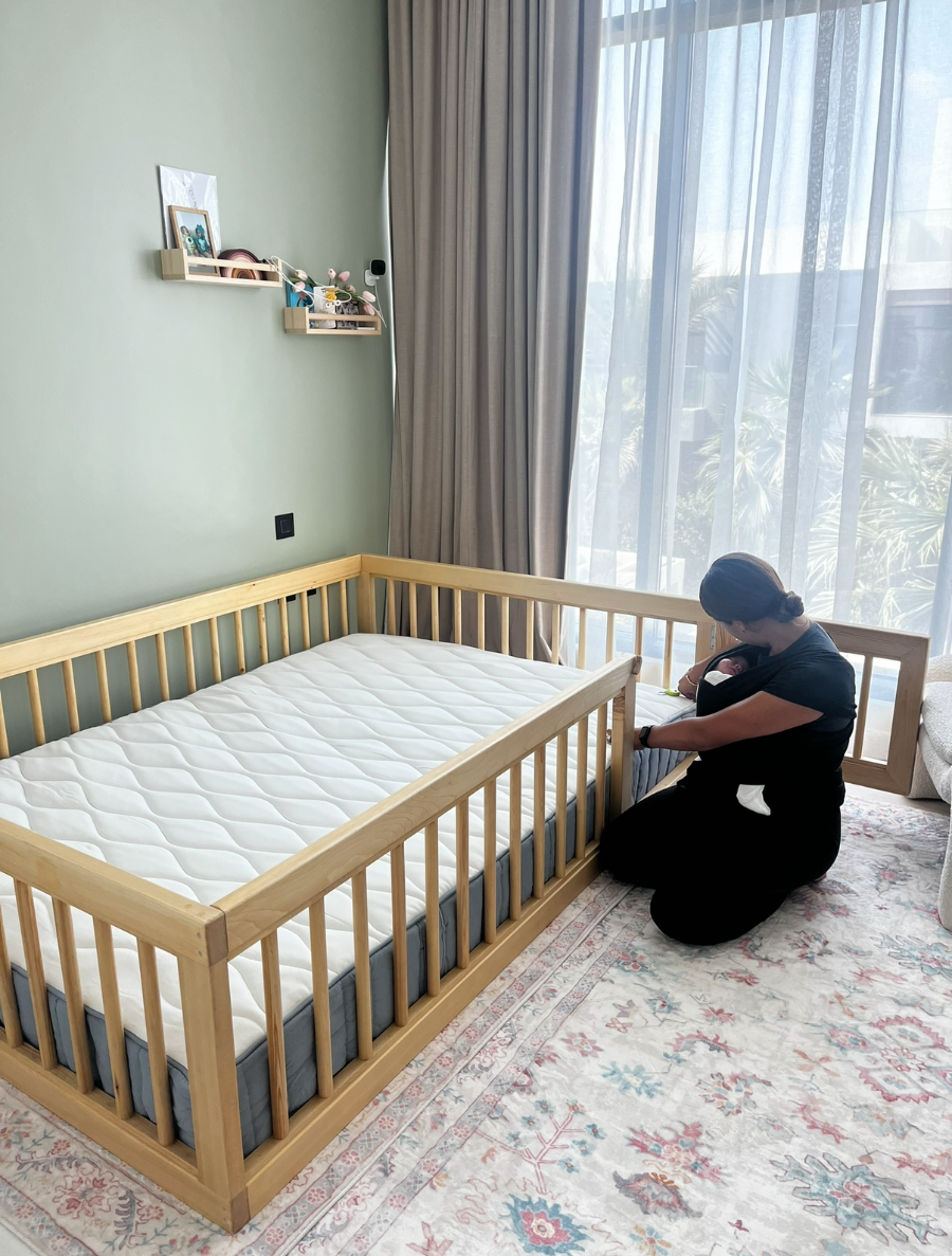 Libby Edwards-Smith, founder of Ezzy Kids, with her daughter beside a handmade floor bed in Dubai